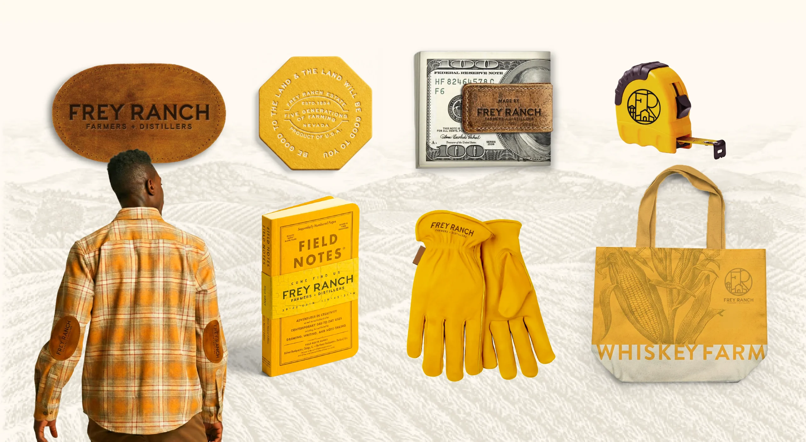 Frey Ranch premium bourbon whiskey brand design system for ground-to-glass Nevada craft distillery showcasing merchandise, brand giveaways, and visual identity elements.