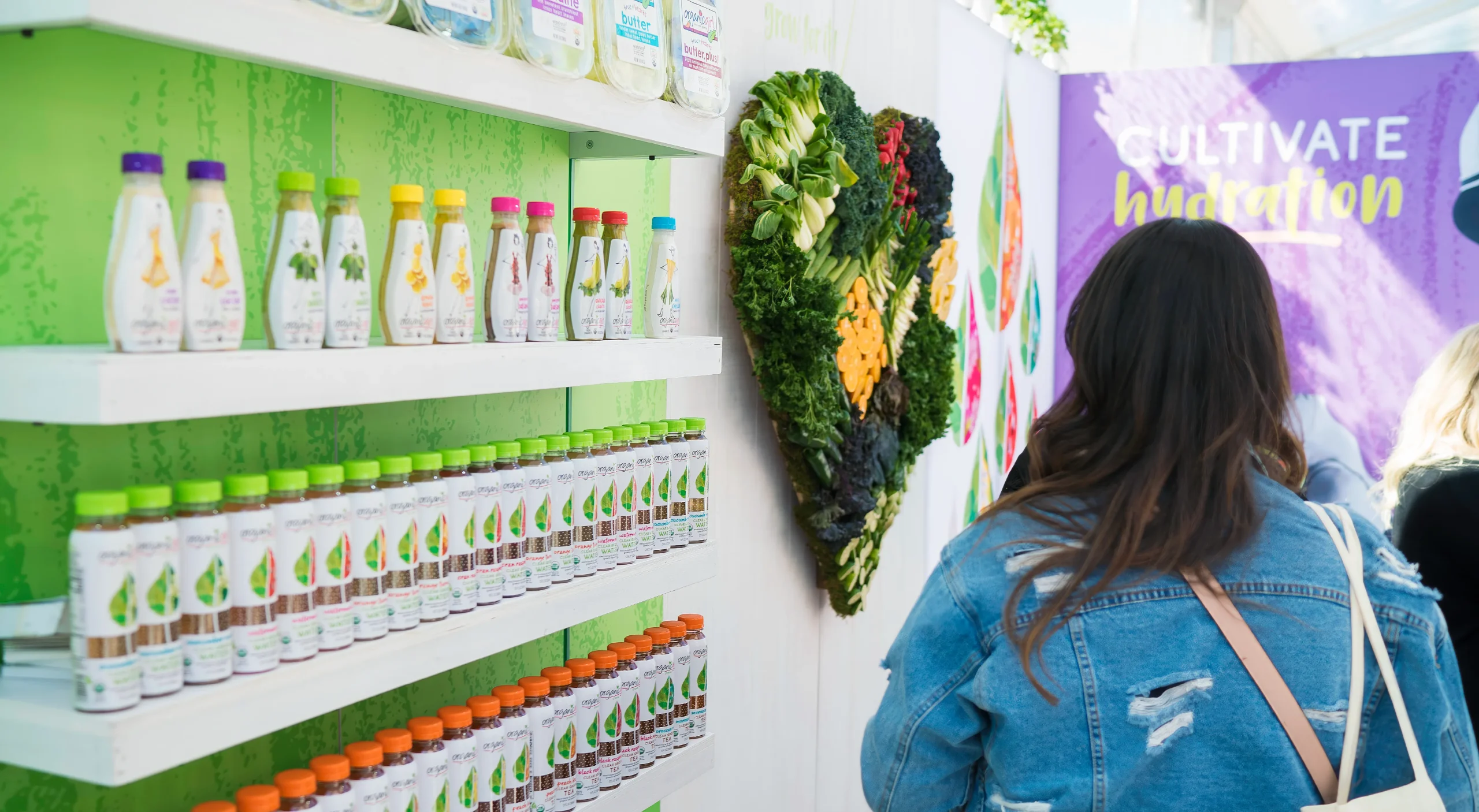 Organicgirl clear greens organic functional beverage brand design system showcasing Natural Products Expo West trade show booth design.